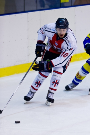MILAN - JANAURY 2   F  Doyle check the puck by Knackstedt   HC Milan  on the game HC Milan - HC Fassa   Italian Premier League   on January, 2, 2013, in Milan  Italy のeditorial素材