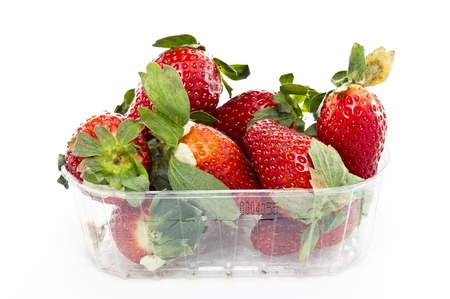 a market basket of strawberries isolated in white backgroundの写真素材