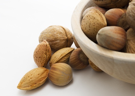 several nuts in basket and white backgroundの写真素材