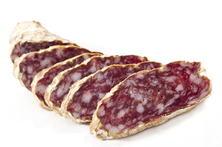 Slices of Salame from Italy on white backgroundの写真素材
