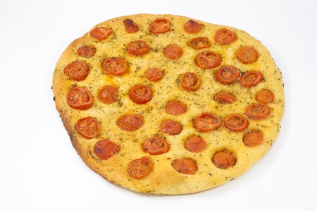 homemade focaccia with tomatoes and oregano on white backgroundの写真素材