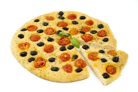 homemade focaccia with tomatoes, olives  and oregano on white backgroundの写真素材