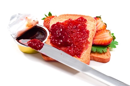 Crispbread and strawberry jam isoltaed on white backgroundの写真素材