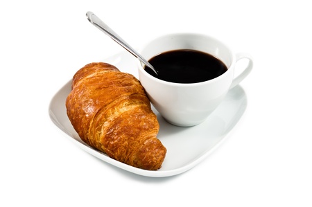 breakfast with cup of black coffee, croissant on white plat isolated on wite backgroundの写真素材