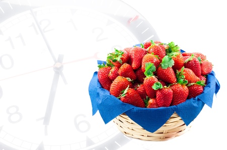 a basket of strawberries on clockの写真素材