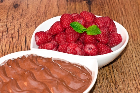 chocolat dessert whit raspberries on wooden tableの写真素材