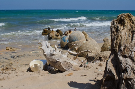generic plastic waste accumulates on the beachの写真素材