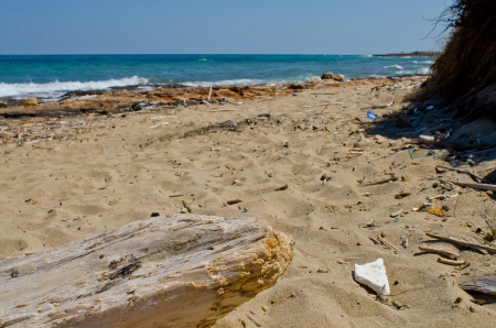 generic plastic waste accumulates on the beachの写真素材