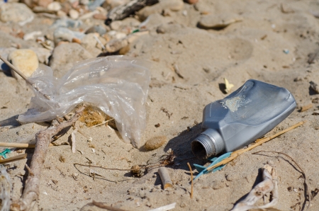 generic plastic waste accumulates on the beachの写真素材