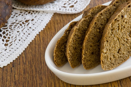 integral bread over wooden tableの写真素材
