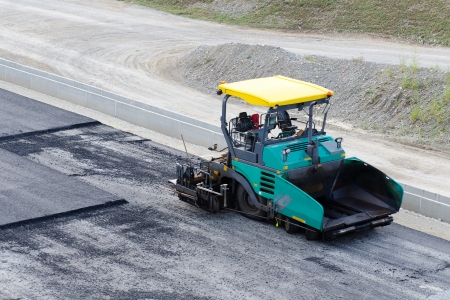 pavement machine ready for laying fresh asphalt or bitumen の写真素材