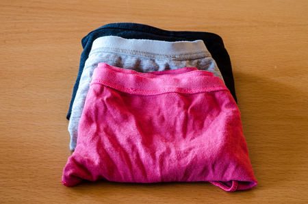 colorated underwear on wooden tableの写真素材