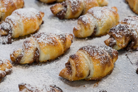 little homemade chocolat brioches with sugar on morning lightの写真素材