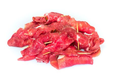 raw uncooked beef roulades isolated on white backgroundの写真素材