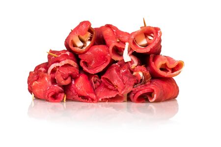 raw uncooked beef roulades isolated on white backgroundの写真素材
