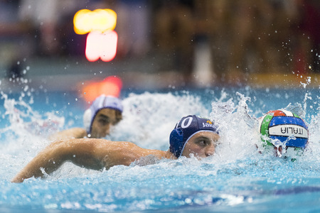 NAPOLI - MAY 12: G. Bini ( Blue cap, Bpm Sport Management) in game BPM Sp. Management vs Acquachiara Napoli  - Italian Water Polo Play Off on May 12, 2015 in Napoli, Italy.のeditorial素材