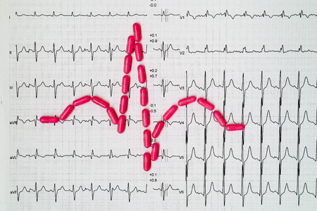 egc pills and paper ecg background