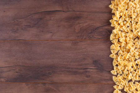 Pasta on the right of wooden board with copy spaceの写真素材