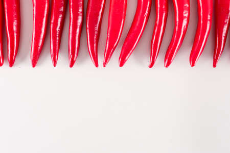 Red fresh pepper up of frame on white background with copy spaceの写真素材