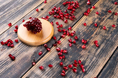 Pomegranate on wooden tableの写真素材