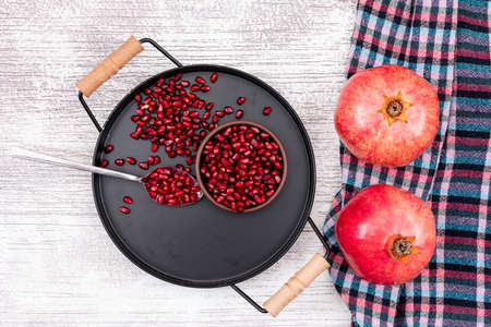 Pomegranate top view in metal black tray1の写真素材