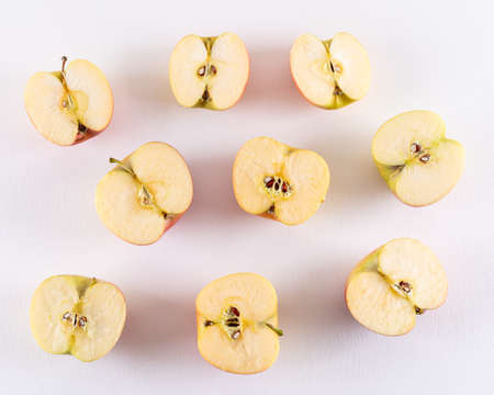 Top view apples half sliced on white background horizontal