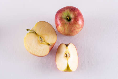 Top view red apples sliced on white background horizontal 1の写真素材
