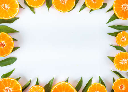 Oranges with leaves frame conceptの写真素材