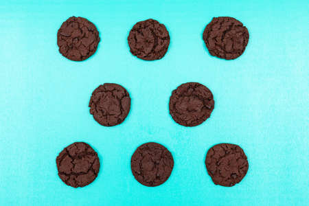 Top view chocolate cookies on blue background