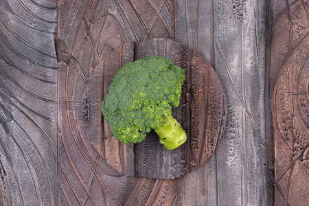 Top view fresh broccoli on wooden texture background