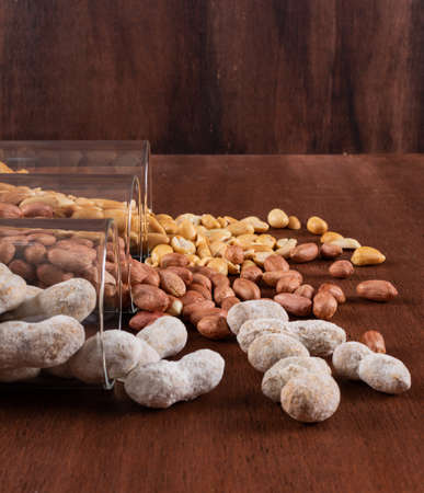 Side view peanuts in glasses on brown backgroundの写真素材