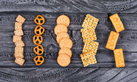 Top view of crackers on dark background horizontal