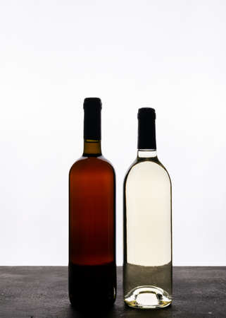 Side view wine in bottles on white background verticalの写真素材