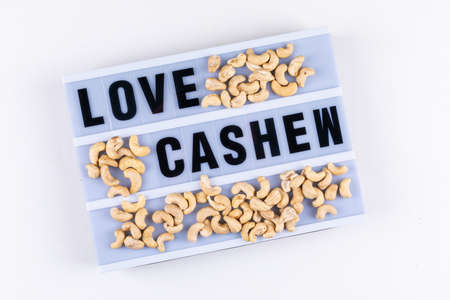 Side view love cashew board on white background. horizontal