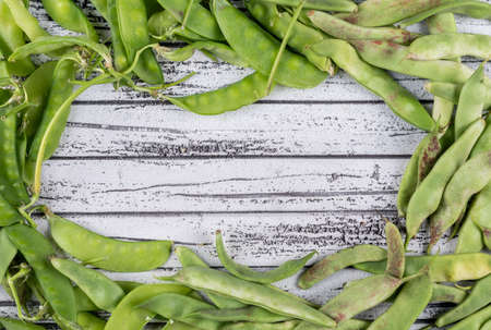 Peas on a gray wooden background. flat lay. space for text
