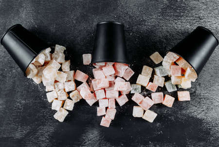 Top view turkish delight lokums in buckets on black textured background. horizontalの写真素材