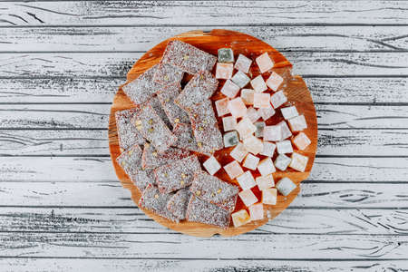 Top view turkish delight lokums on wood and white wooden background. horizontalの写真素材