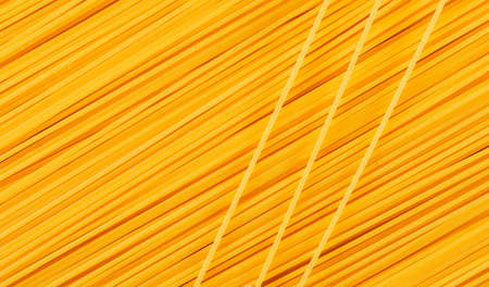 Yellow raw spaghetti . close-up. horizontal.