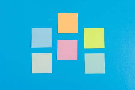 Conceptual of notes idea with colorful sticky notes on cyan blue background flat lay. horizontal imageの写真素材