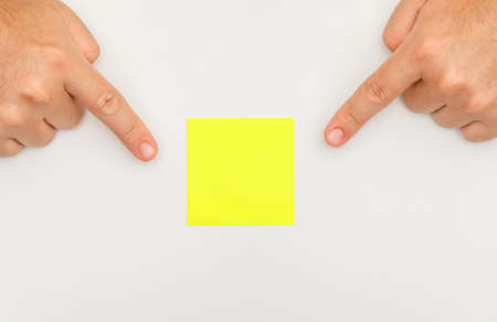 Business strategy concept on white backgroud flat lay. fingers showing sticky note.