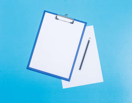 Conceptual of finance and accounting. with paper holder, paper and pencil on cyan blue background...