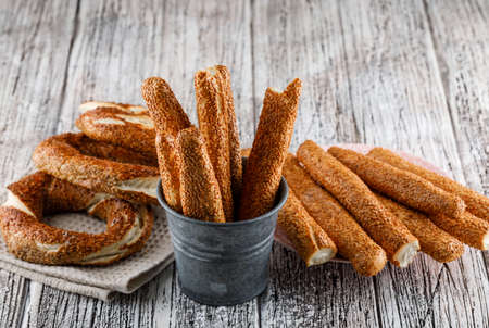 High angle view turkish bagel with a cup of tea and bread on wooden background. horizontal の写真素材