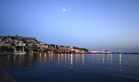Kavala, Greece - illuminated city around the harborのeditorial素材