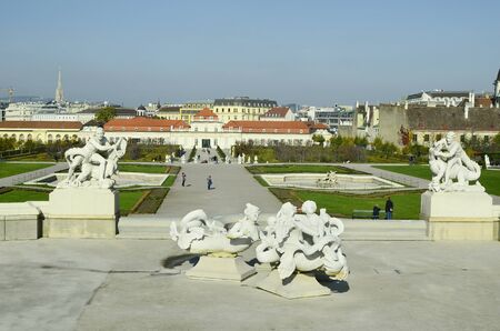 Vienna, Austria - November 1st 2014: Unidentified tourists, sculptures and lower belvedere palace with city viewのeditorial素材