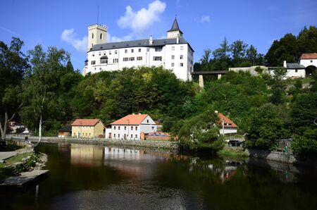 Czech Republic, village Rozmberk nad Vltavou with castle and reflection in river Vltavaのeditorial素材