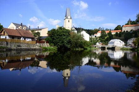 Czech Republic, village Rozmberk nad Vltavou with castle and reflection in river Vltavaのeditorial素材