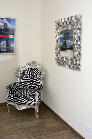 Buchensteinwand, Austria - March 3rd 2015:Inside accesable Jakobs cross on mountain summit in Tyrol with artful chair, the building has rentable rooms for events and meetingsのeditorial素材