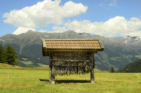 Austria, agriculture equipment on mounatian village Ladis in Tirolの写真素材
