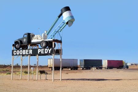 Towns Landmark from Coober Pedy and Road Train with trailers on Stuart highwayのeditorial素材