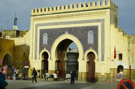 Fes, Morocco - November 20th 2014: Unidentified people at Bab Boujeloud the entrance to souk Fes el-Baliのeditorial素材